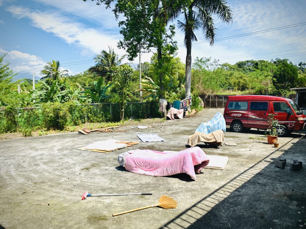 a group of mattresses on a road