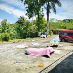 a group of mattresses on a road